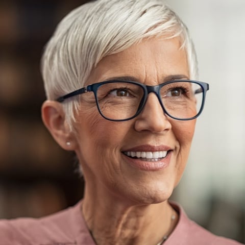 women smiling wearing glasses